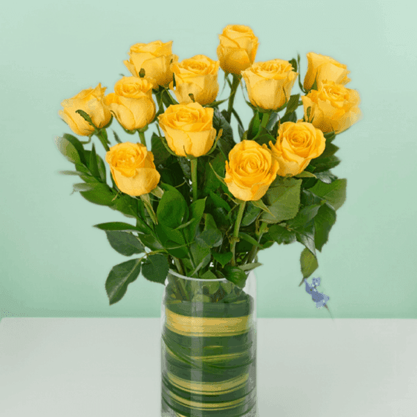 Classic dozen Yellow Roses (3) Classic dozen yellow rose bouquet wrapped elegantly with fresh green fillers and ribbon, perfect for birthday celebrations, anniversaries, and cheerful gifting moments.