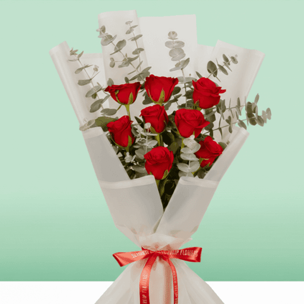 Romantic arrangement of 8 red roses in rich crimson tones, perfect for special moments.