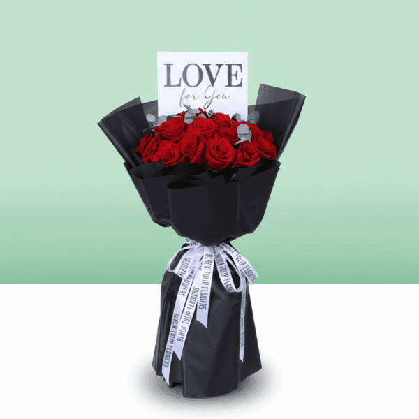 Premium red roses and eucalyptus arrangement in black wrapping with a “Love For You” card